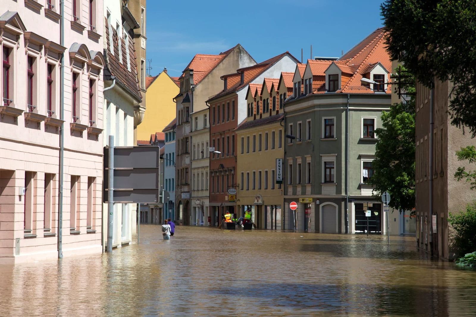Street flooding in a European city with historic architecture